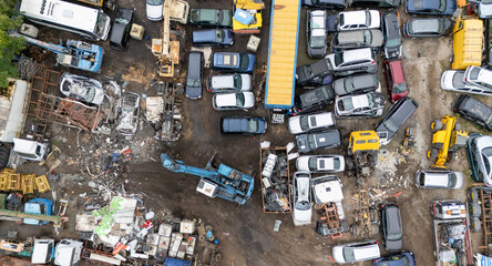 Aerial View of Cluttered Junkyard with Vehicles and Machinery