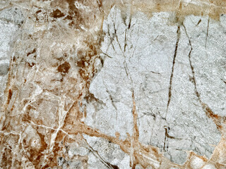 Natural bright golden grey marble texture with  dark red veins and black veins. Bright warm grey natural marble stone, Seamless background texture.