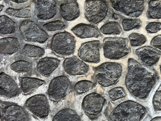Natural flagstone or flattened flag stones, a series of cobble stone but flattened and paved seamlessly, for floor or wall finishes.  