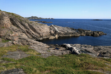Landscape photo with a view of a sea and rocky shore in the village of A on the Lofoten Islands in Norway