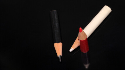 Creative tools gather together in vibrant colors on a glossy surface