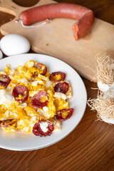 Turkish local breakfast food fried sausage with eggs (sucuklu yumurta)