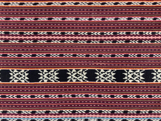 Traditional hand sewn ethnic fabric cloth in random stripes and decorative ornamental pattern, with...
