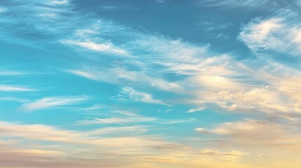 Obraz premium Expansive Blue Sky with Wispy Clouds at Golden Hour