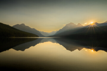 Warm Sunburst Starts The Day Over Bowman Lake In Glacier