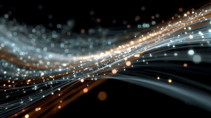 Glowing fiber optic light strands with bokeh sparks on black background.