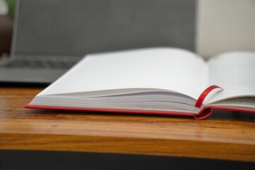 Minimalist Workspace with Red Notebook