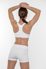 Fototapeta premium Fitness woman. Portrait of a young athletic brunette model