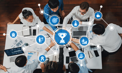 A dynamic business meeting scene where professionals engage in collaborative data analysis. Digital icons symbolize success and growth in modern corporate settings. Amity