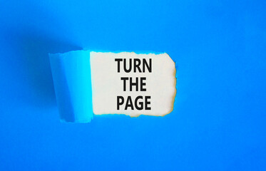 Turn the page symbol. Concept words Turn the page on beautiful white paper. Beautiful blue paper background. Business motivational lifestyle turn the page concept. Copy space.