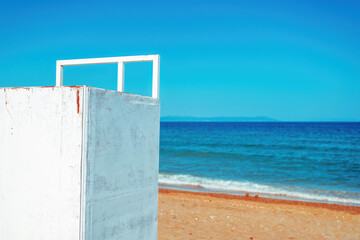 Beach changing room or dressing booth at Aegean sea shoreline in summer