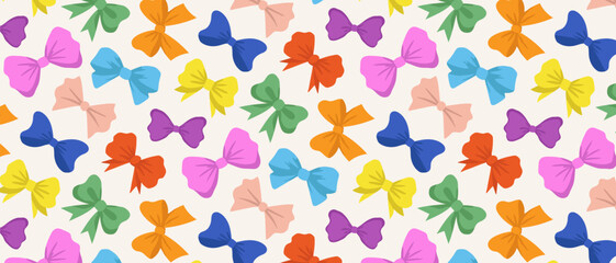 Seamless pattern of bright multi-colored bows. Bright ribbons on a white background.