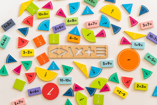 Colorful educational math manipulatives arranged on a flat surface for teaching young children basic arithmetic