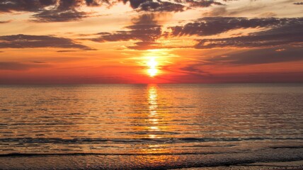 Fototapeta premium Dreamlike beach sunset with golden sunlight reflecting across calm ocean