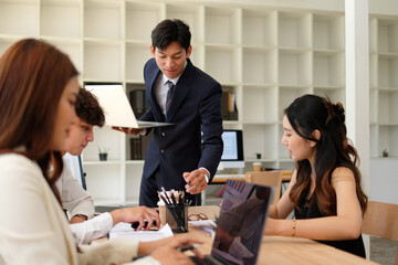 Presentation in a meeting, businessman presenting on a tablet