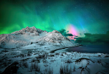Aurora borealis or northern lights during winter night