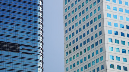 Contemporary architecture showcasing two unique skyscraper designs side by side