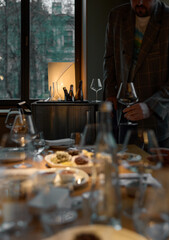 Several bottles of champagne are cooled in a niche with ice in the restaurant, local lighting, wine cabinet, decanters for sparkling wine