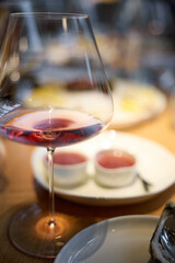 A glass of sparkling wine in close-up, Champagne tasting, Wine glasses are on the table, stylish table setting, sparkling wine bubbles, oysters and sea urchins, special sauce