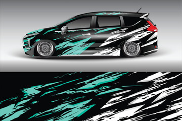 Stylish black and teal car wrap design showcasing motion