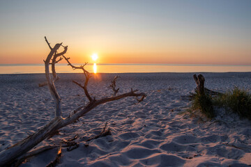 Sunset over the Baltic Sea illuminating the serene Darß Peninsula beach in Germany