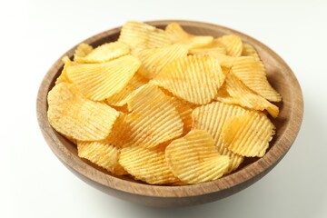 Tasty potato chips in bowl on white background, closeup