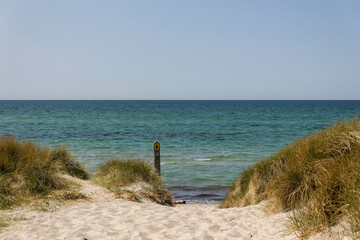 Scenic view of the Baltic Sea from the Darß peninsula, showcasing beach access and vibrant blue waters