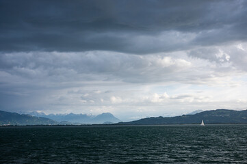 Alpine Lake under Dramatic Sky