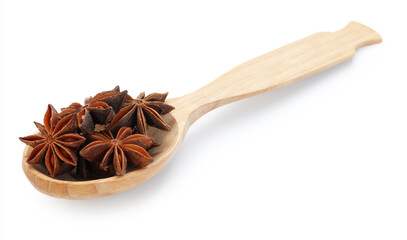 Aromatic anise stars in wooden spoon isolated on white