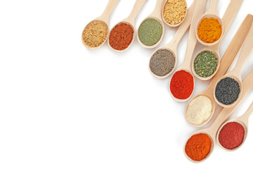 Different aromatic spices in spoons isolated on white, top view