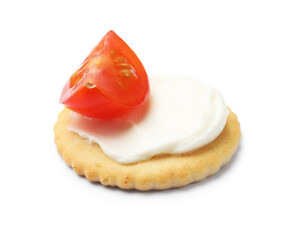 One tasty cracker with cream cheese and tomato isolated on white