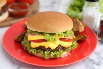 Tasty cheeseburger on white marble table, closeup