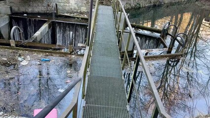 Bridges and Reflective Water Surfaces Captured in an Abandoned Industrial Location Setting