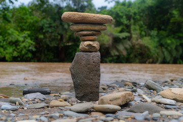 Balancing stones in nature, rivers and jungle