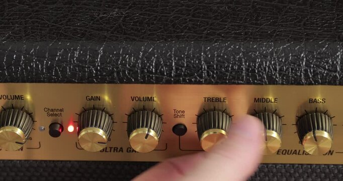 Guitar amplifier tone equalizer knobs maxed out