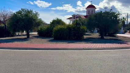 Obraz premium A Charming and Picturesque Landscape Featuring Olive Trees and Traditional Architecture