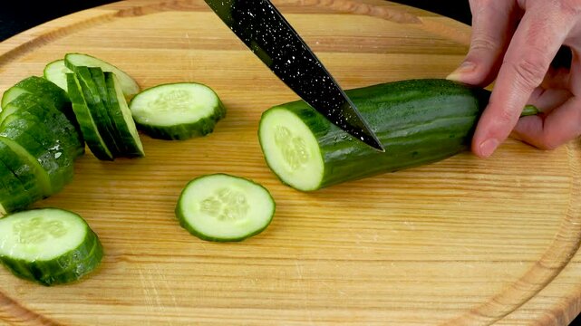 Very satisfying and relaxing cucumber ASMR video. Cutting anti-stress macro close-up colorful cucumber with a knife. ASMR sounds.
