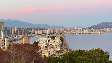 Naklejka premium Experience the Stunning Coastal View of Benidorm at Sunset, a breathtaking sight