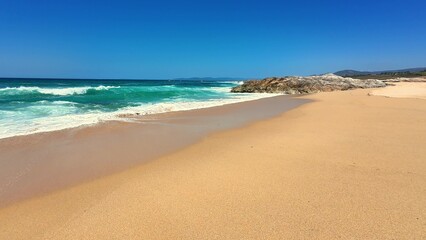 Experience the Serene Beach featuring stunning Turquoise Waves alongside Golden Sand stretch