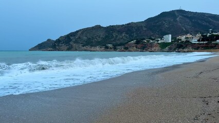 Experience the Serene Coastal Waves at Dusk, capturing natures tranquility and beauty