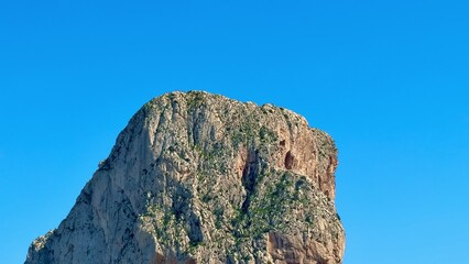 A Stunning and Beautiful Scenic View of the Majestic Rocky Mountain and Clear Blue Sea