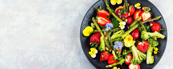 A refreshing asparagus salad with strawberries.