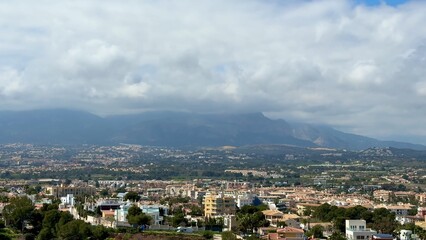 Stunning Aerial View of a Beautiful Coastal Landscape with Majestic Mountains and Clouds