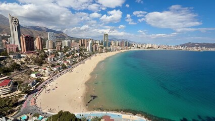 Fototapeta premium Stunning Coastal View of Benidorm Beach and the City Skyline Captivating Visitors