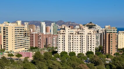 A stunning Coastal City Skyline showcasing Modern Architecture against a backdrop of Blue Skies