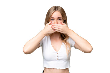 Young English woman over isolated background covering mouth with hands