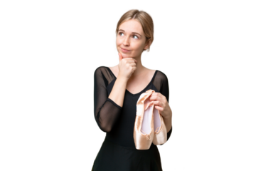 Young English woman practicing ballet over isolated background and looking up