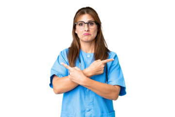 Middle age nurse woman over isolated background pointing to the laterals having doubts