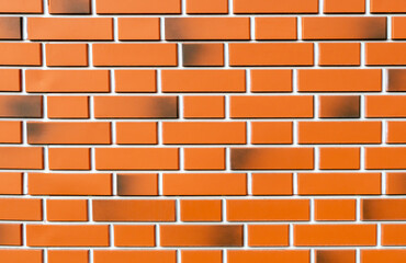 Stylish new red brick wall texture with straight lines. Background design closeup. Copy space.