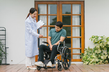 Doctor Consulting Patient in Wheelchair